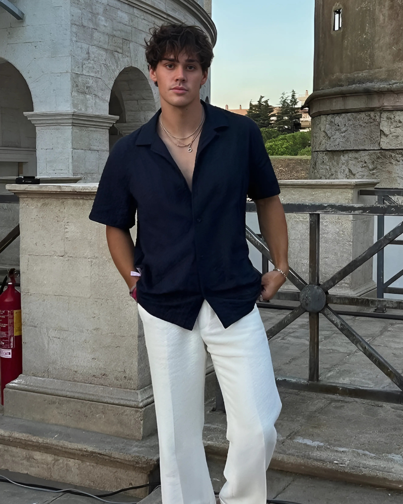 Black Short Sleeve Shirt, Beige Trousers and Gold Medallion Necklace Outfit