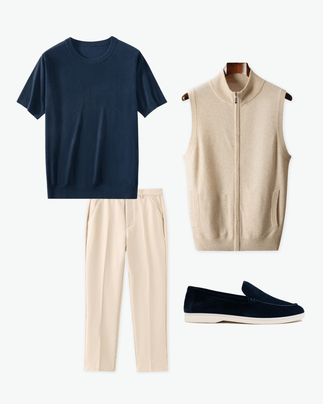 Navy t-shirt, beige pants, beige vest, and navy loafers on a white background