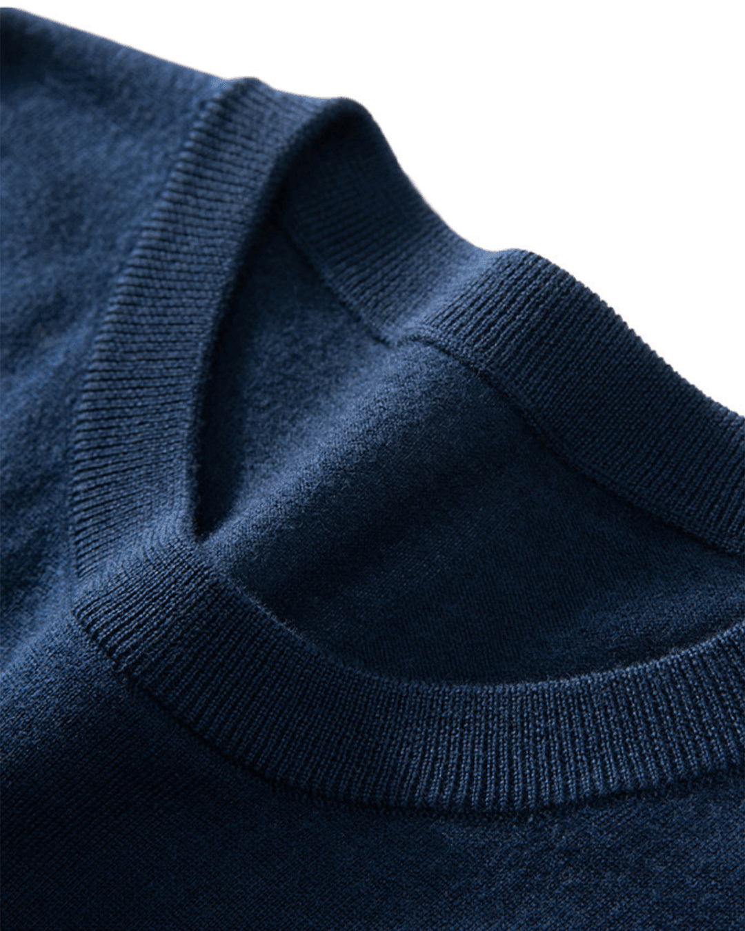 Close-up of a navy blue sweater collar on a white background