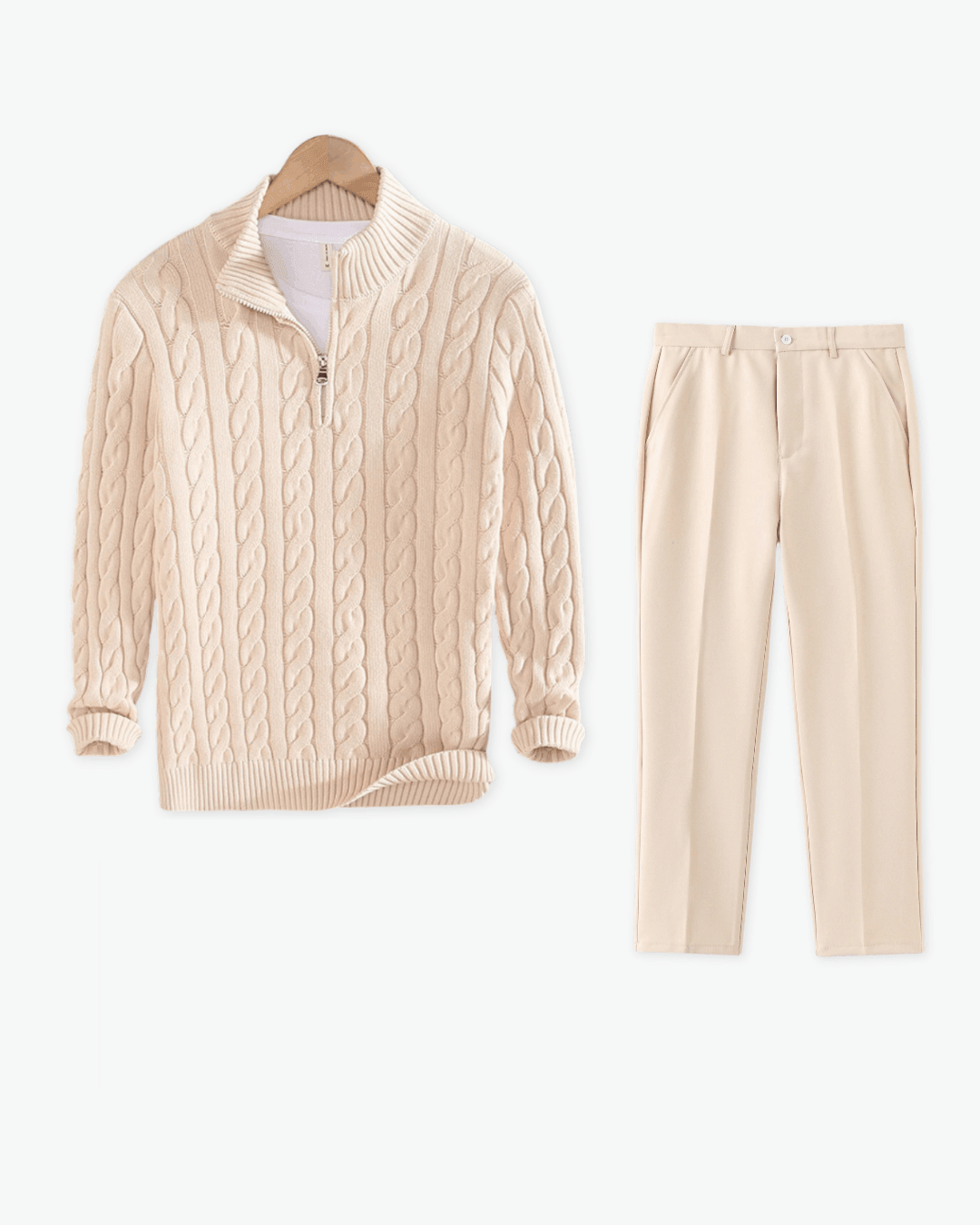 Beige cable-knit cardigan and pants on a white background
